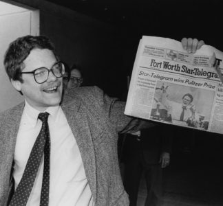 Mark Thompson holding the edition of the Fort Worth Star-Telegram that announced his Pulitzer win. Photo credit: Mark Thompson