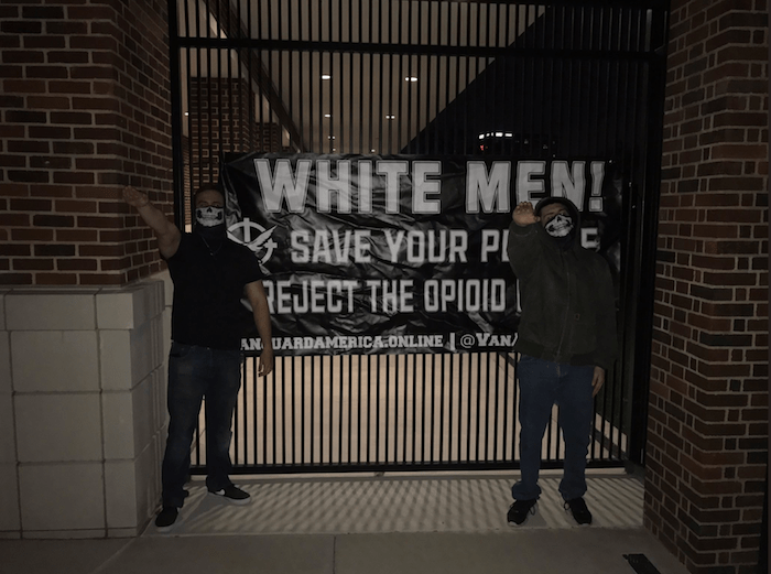White nationalists hang racist, homophobic signs, give Nazi salute on campus