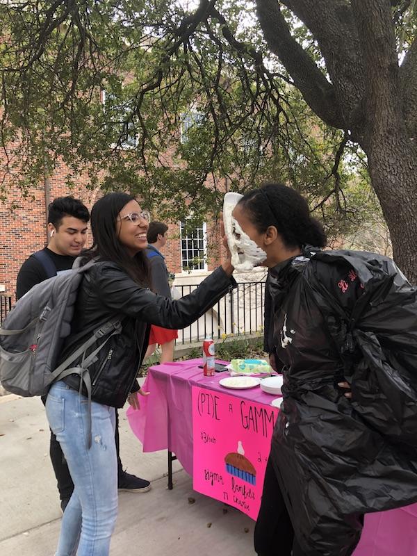 SMU student being pied by their friend. jpg
