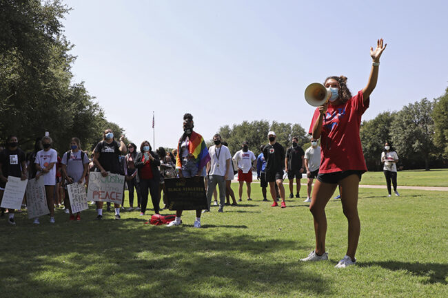 Ashton Woods leads the protest at SMU for student-athletes.