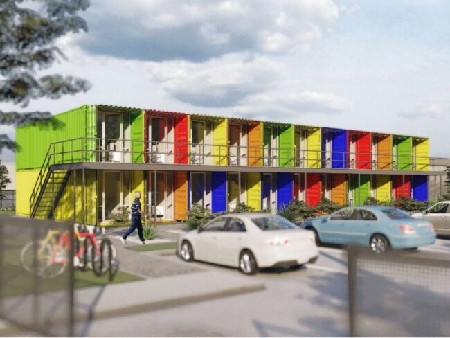 A rendering of an apartment complex made of multi-colored shipping containers