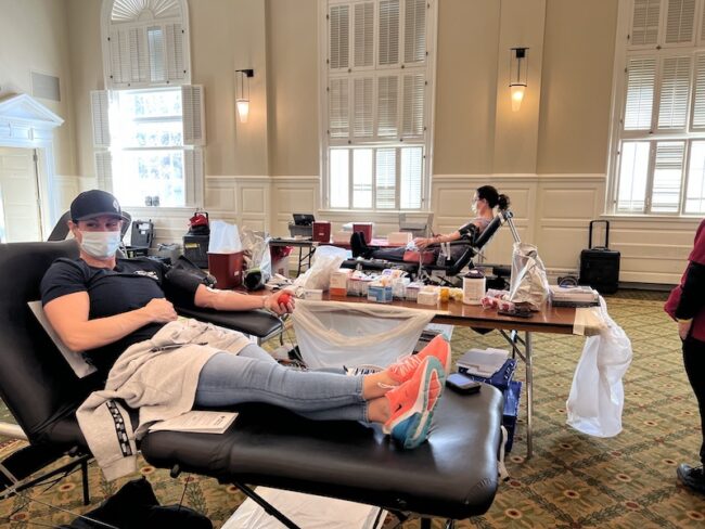 A woman donating blood at SMU in 2022 at a blood drive.
