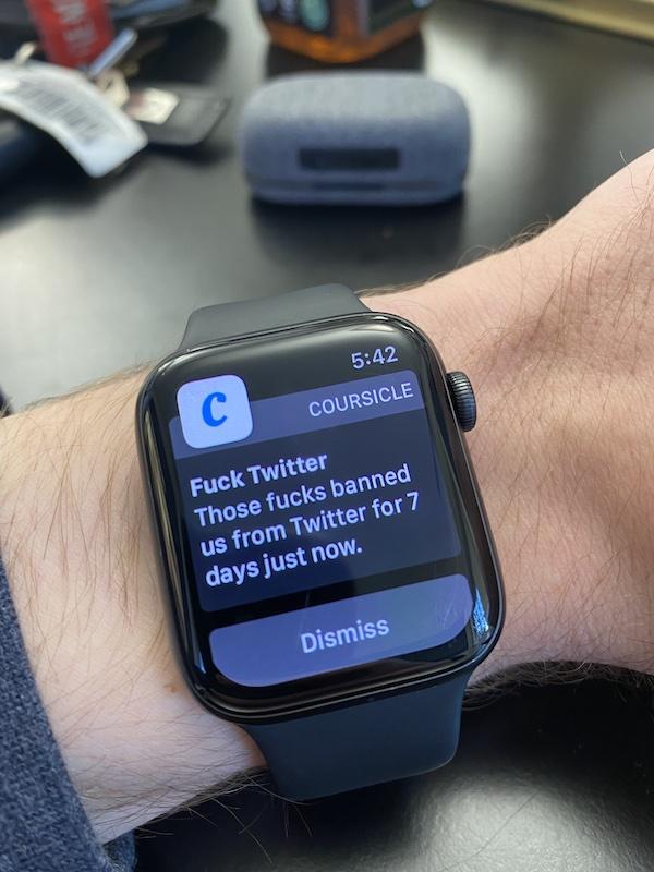 An Apple watch on a wrist with a push notification