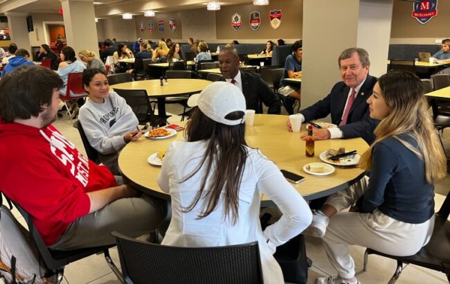 President Turner and Vice President for Student Affairs, Dr. Mmeje, eats lunch with four students in Umphrey Lee Dining Hall on Nov. 2, 2022.